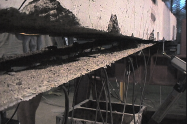 Peeling failure in concrete strengthened with CFRP 