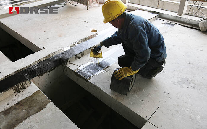 Repair and strengthening of reinforced concrete slab with carbon fiber reinforced polymer